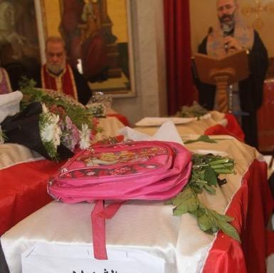 The coffin of 13 year-old Selena Saloum with her school bag perched on top. (Photo: Tweet by Kevork Almassian)